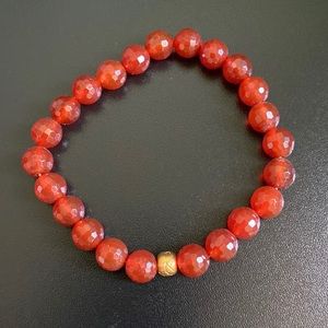 Satya Jewelry carnelian bracelet with gold lotus bead